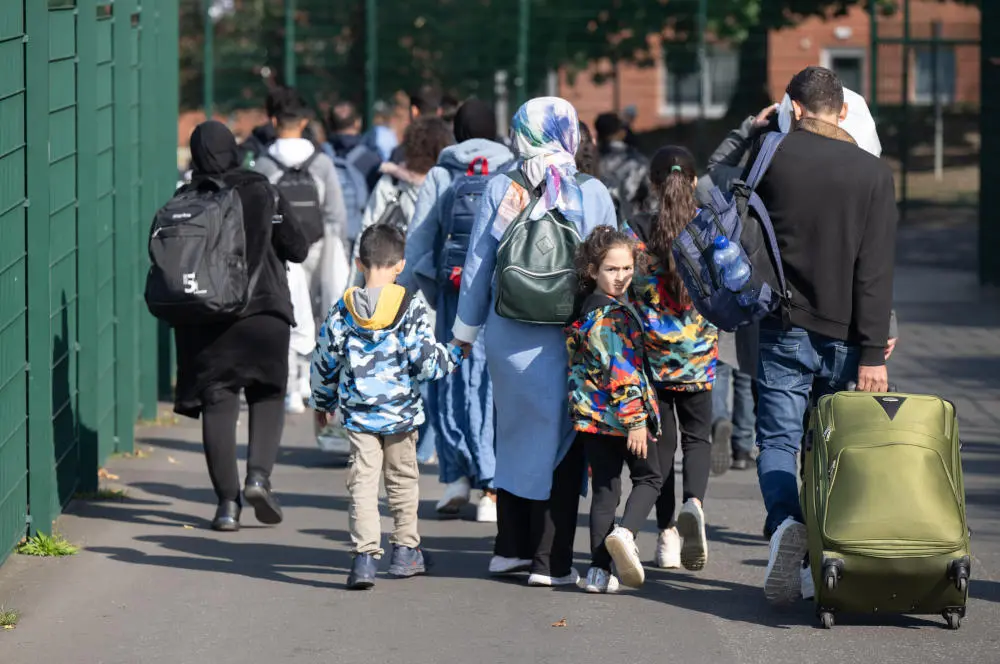 Flüchtlinge kommen in der hessischen Erstaufnahmeeinrichtung in Gießen an